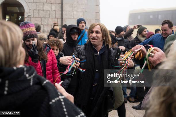 Transvestite, known in the Neapolitan tradition as "femminiello", dances with castanets near the sanctuary on February 2, 2018 in Avellino, Italy....