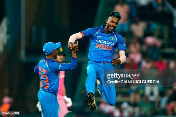 Indian bowler Hardik Pandya celebrates the dismissal of South African batsman AB de Villiers during the fourth One Day International cricket match...