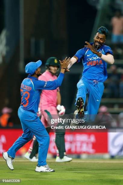 Indian bowler Hardik Pandya celebrates the dismissal of South African batsman AB de Villiers during the fourth One Day International cricket match...