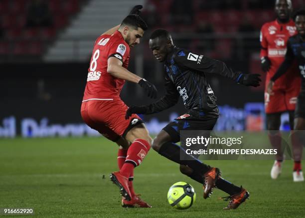 Nice's French midfielder Albert Rafetraniaina vies with Dijon's French-Algerian midfielder Mehdi Abeid during the French L1 football match between...