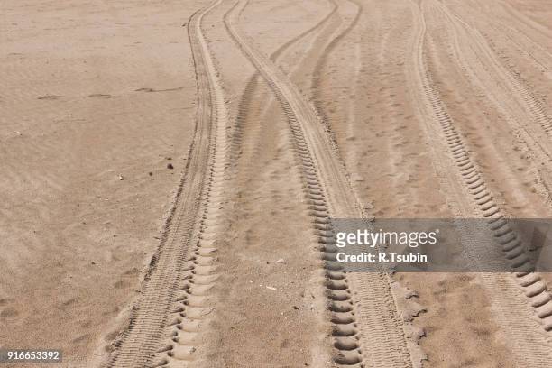 sand car tire tracks - following path stock pictures, royalty-free photos & images