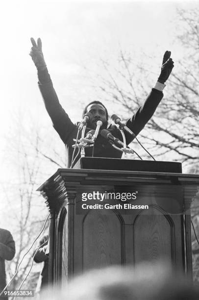 American comedian and activist Dick Gregory speaks from a podium during the Moratorium March On Washington to protest the war in Vietnam, Washington...
