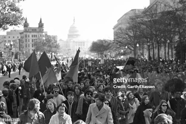 View of demonstrators, many with signs, banners, or Viet Cong flags, on Pennsylvania Avenue during the Moratorium March On Washington to protest the...