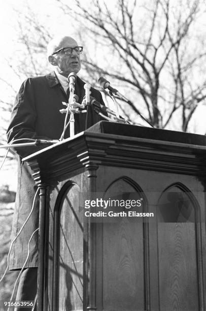 American pediatrician and activist Dr Benjamin Spock speaks from a podium during the Moratorium March On Washington to protest the war in Vietnam,...