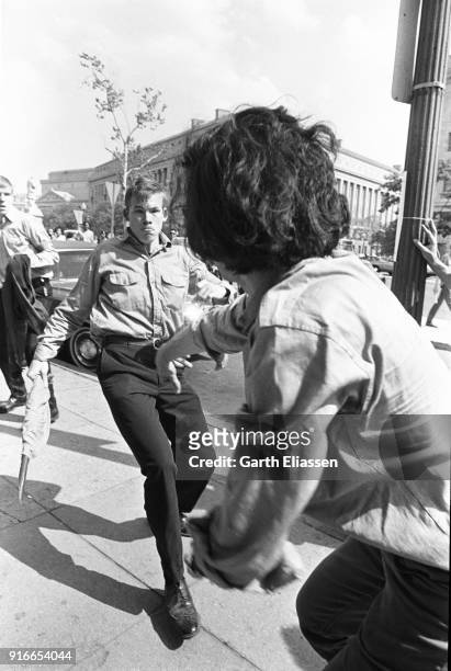 During a nationwide student strike , a neo-Nazi counter-protestor fights with a demonstrator on Pennsylvania Avenue, Washington DC, May 9, 1970....