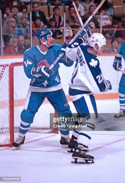 Borje Salming of the Toronto Maple Leafs skates against John Anderson of the Quebec Nordique during NHL game action on October 12, 1985 at Maple Leaf...