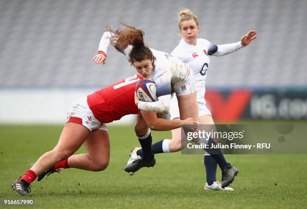 Charlotte Pearce of England is tackled by the welsh defence during the Natwest Women's Six Nations Championships at Twickenham Stoop on February 10,...