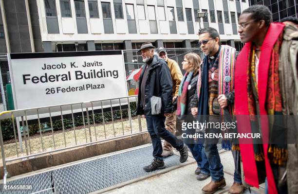 Immigrant rights activist Ravi Ragbir walks in front of the Immigration building during a Rally a day after he granted temporary stay of deportation...