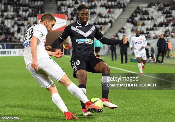 Bordeaux's French midfielder Souahilo Meite vies for the ball with Amiens' Moroccan defender Oualid El-Hajjam during the French L1 football match...