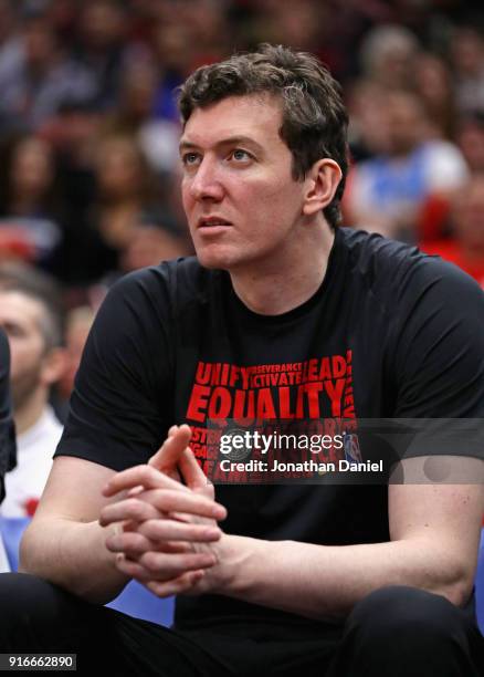 Omer Asik of the Chicago Bulls watches from the bench as his teammates take on the Minnesota Timberwolves at the United Center on February 9, 2018 in...