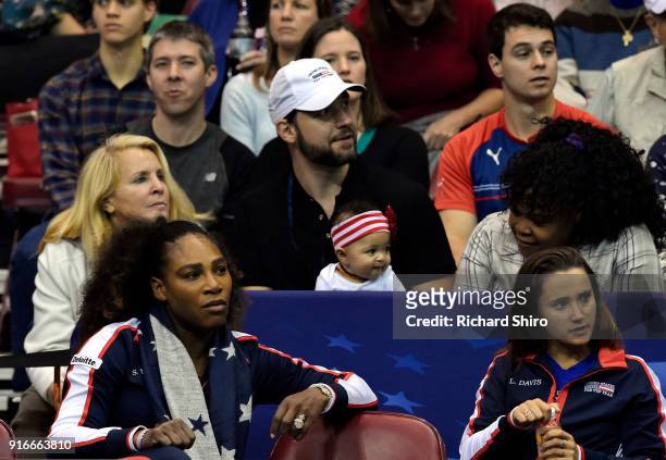 Serena Williams of Team USA, bottom left, along with her husband Alexis Ohanian and their daughter Alexis Olympia, center, watch the action during...