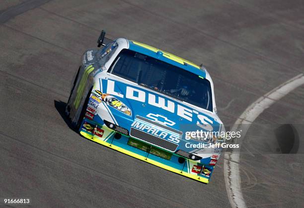 Jimmie Johnson drives the Lowes's Chevrolet during practice for the NASCAR Sprint Cup Series Pepsi 500 at Auto Club Speedway on October 9, 2009 in...