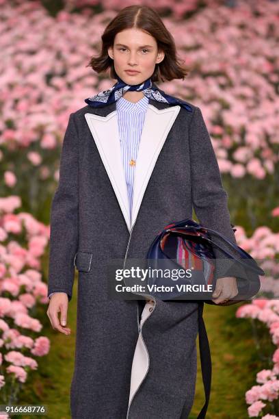 Model walks the runway during the Tory Burch Ready to Wear Fall/Winter 2018-2019 fashion show during New York Fashion Week at Bridge Market on...