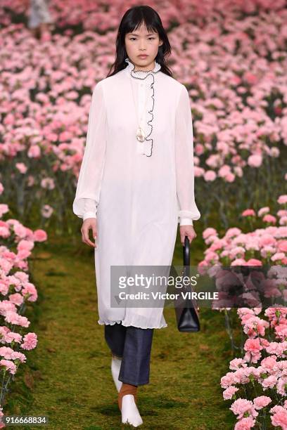 Model walks the runway during the Tory Burch Ready to Wear Fall/Winter 2018-2019 fashion show during New York Fashion Week at Bridge Market on...