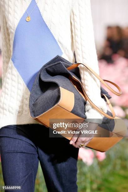 Model walks the runway during the Tory Burch Ready to Wear Fall/Winter 2018-2019 fashion show during New York Fashion Week at Bridge Market on...