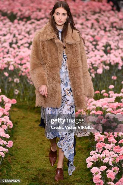 Model walks the runway during the Tory Burch Ready to Wear Fall/Winter 2018-2019 fashion show during New York Fashion Week at Bridge Market on...