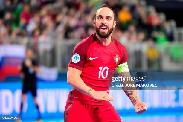 Portugals Ricardinho celebrates after scoring a goal during the European Futsal Championship final football match between Portugal and Spain at Arena...