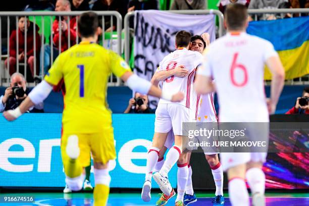 Spains players celebrate after scoring a goal during the European Futsal Championship final football match between Portugal and Spain at Arena...