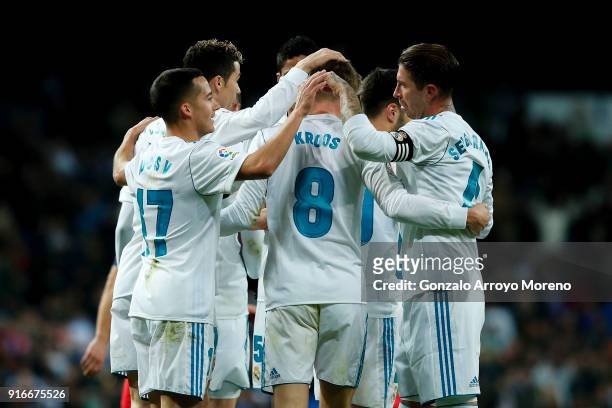 Toni Kroos of Real Madrid CF celebrates scoring their third goal with teammates during the La Liga match between Club Atletico Madrid and UD Las...