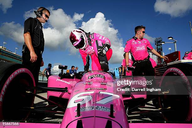 Sarah Fisher climbs aboard the Komen For The Cure Sarah Fisher Racing Dallara Honda during the IRL IndyCar Series Firestone Indy 300 on October 9,...