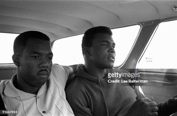 Portrait of Muhammad Ali sitting in car with friend, photographer Howard Bingham. Las Vegas, NV 11/5/1965 CREDIT: Lee Balterman