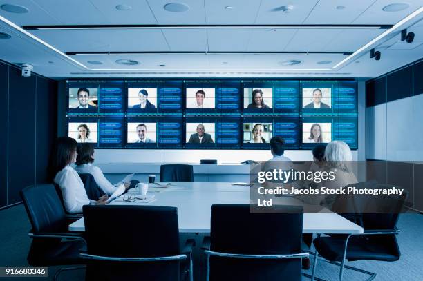 video conference in modern conference room - meeting room screen stock-fotos und bilder