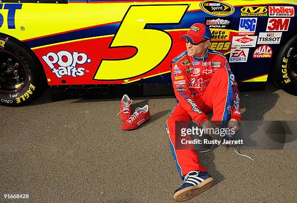 Mark Martin, driver of the Kellogg's CarQuest Chevrolet Chevrolet changes his shoes on pit road during qualifying for the NASCAR Sprint Cup Series...