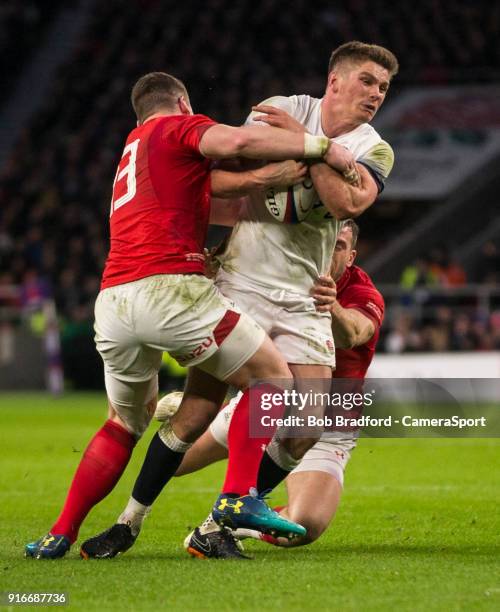 Englands' Owen Farrell is tackled by Wales' Scott Williams during the NatWest Six Nations Championship match between England and Wales at Twickenham...