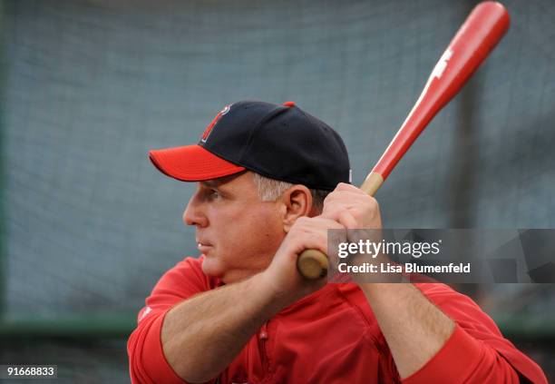 Mike Scioscia manager of theLos Angeles Angels of Anaheim participates in batting practice before Game Two of the ALDS against the Boston Red Sox...