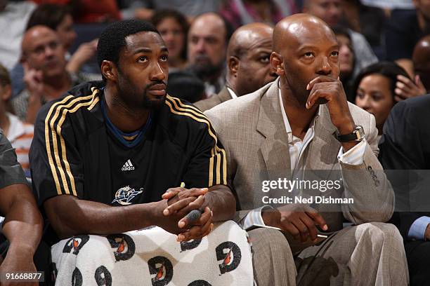 Gilbert Arenas and Assistant Coach Sam Cassell of the Washington Wizards watch game from the bench against the Dallas Mavericks at the Verizon Center...