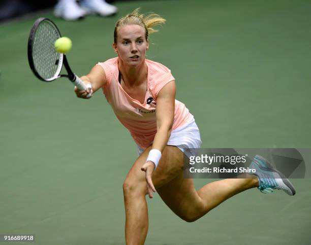 Richel Hogenkamp of the Netherlands returns a volley by Coco Vandeweghe of Team USA during the first round of the 2018 Fed Cup at US Cellular Center...