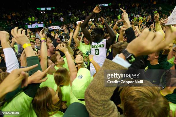 Jo Lual-Acuil Jr. #0 of the Baylor Bears celebrates with fans after defeating the Kansas Jayhawks at the Ferrell Center on February 10, 2018 in Waco,...