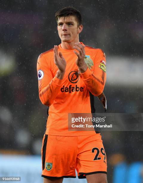 Nick Pope of Burnley applauds the fans at the end of the Premier League match between Swansea City and Burnley at Liberty Stadium on February 10,...