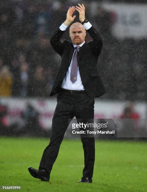 Sean Dyche, Manager of Burnley applauds the fans at the end of the Premier League match between Swansea City and Burnley at Liberty Stadium on...
