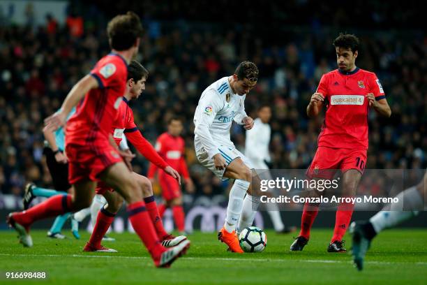 Cristiano Ronaldo of Real Madrid CF competes for the ball with Xabi Prieto of Real Sociedad de Futbol during the La Liga match between Real Madrid CF...