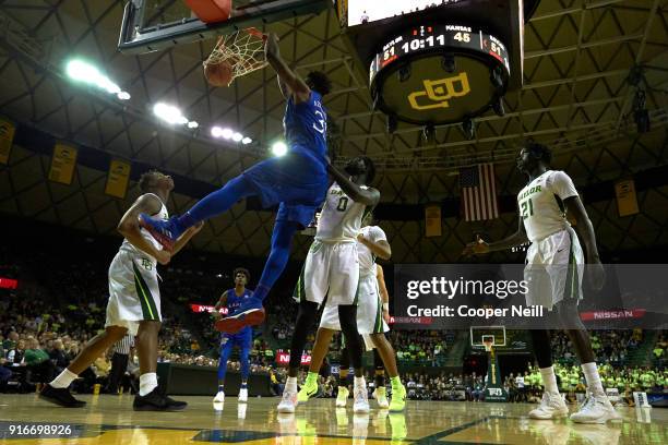 Udoka Azubuike of the Kansas Jayhawks dunks the ball against the Baylor Bears during the second half at the Ferrell Center on February 10, 2018 in...