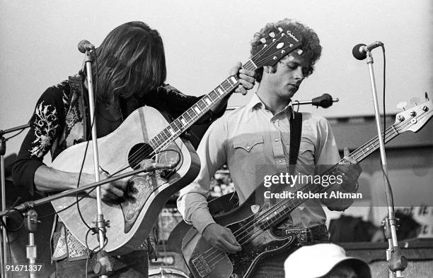 Gram Parsons and Chris Hillman of The Flying Burrito Brothers perform onstage at The Altamont Speedway on December 6, 1969 in Livermore, California.