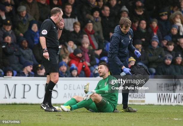 Richard O'Donnell of Northampton Town looks to referee Carl Boyeson after recieving treatment from physio Steve Bottom during the Sky Bet League One...