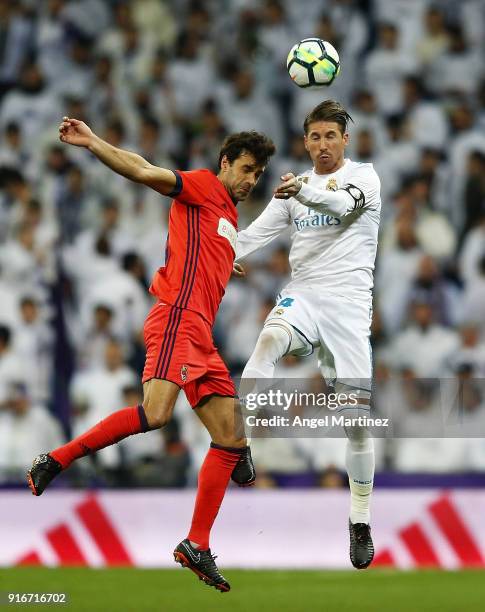 Sergio Ramos of Real Madrid competes for the ball with Xabi Prieto of Real Sociedad during the La Liga match between Real Madrid and Real Sociedad at...