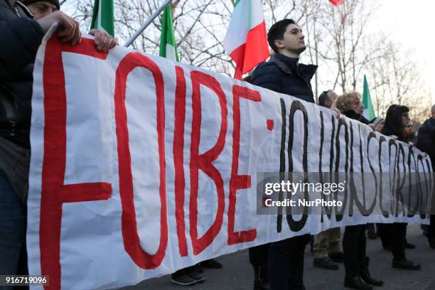 Supporters of Italian far-right movements CasaPound and Forza Nuova march behind a banner reading &quot;Honor to the martyrs of the foibe&quot;...