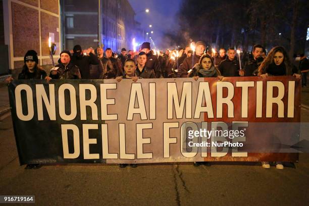 Supporters of Italian far-right movements CasaPound and Forza Nuova march behind a banner reading &quot;Honor to the martyrs of the foibe&quot;...