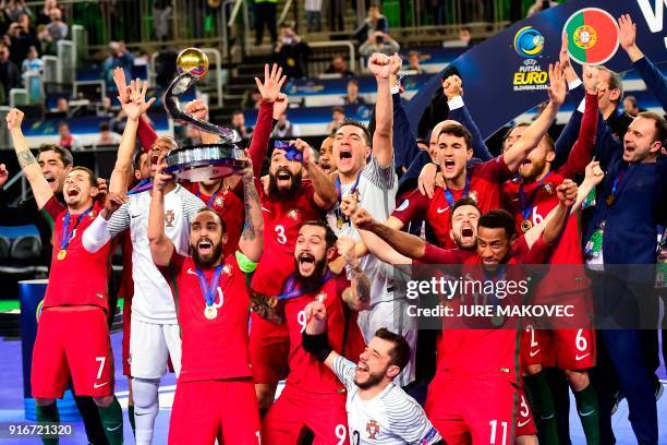 Portugal's national futsal team celebrates after winning the European Futsal Championship at Arena Stozice in Ljubljana on February 10, 2018. / AFP...