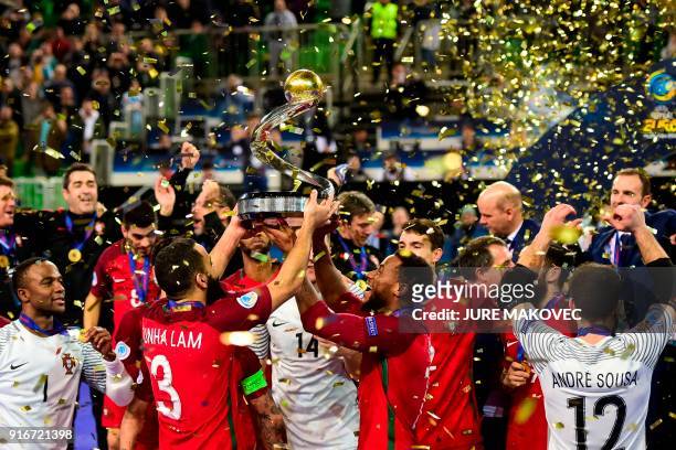 Portugal's national futsal team celebrates after winning the European Futsal Championship at Arena Stozice in Ljubljana on February 10, 2018. / AFP...