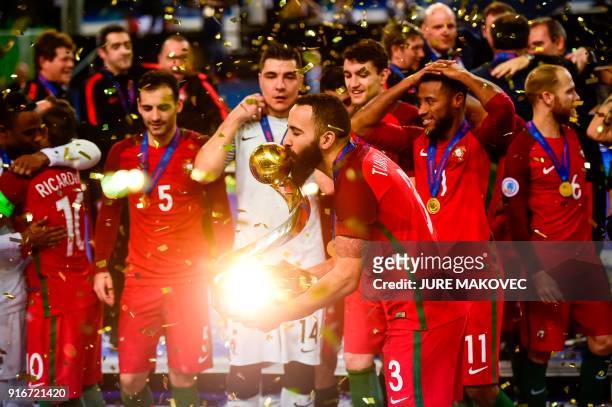 Portugal's national futsal team celebrates after winning the European Futsal Championship at Arena Stozice in Ljubljana on February 10, 2018. / AFP...