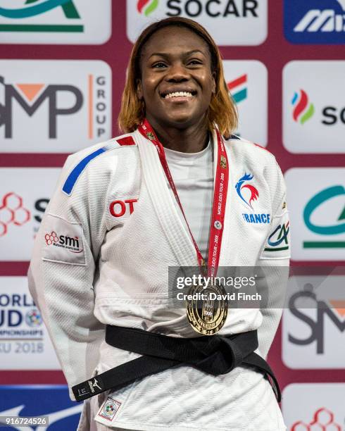 Double World champion and Olympic silver medallist, Clarisse Agbegnenou of France smiles happily wearing her u63kg gold medal during the 2018 Paris...