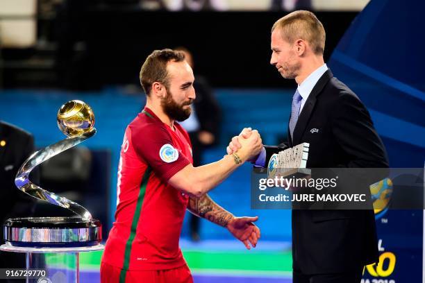 Portugal's Ricardinho receives Player of the Tournament award from UEFA president Aleksander Ceferin after the European Futsal Championship at Arena...