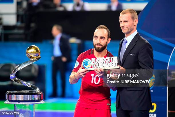 Portugal's Ricardinho receives Player of the Tournament award from UEFA president Aleksander Ceferin after the European Futsal Championship at Arena...