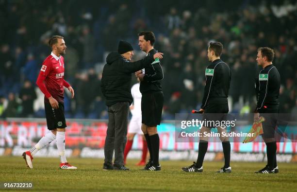 Headcoach Christian Streich of SC Freiburg argues with referee Manuel Graefe after the Bundesliga match between Hannover 96 and Sport-Club Freiburg...