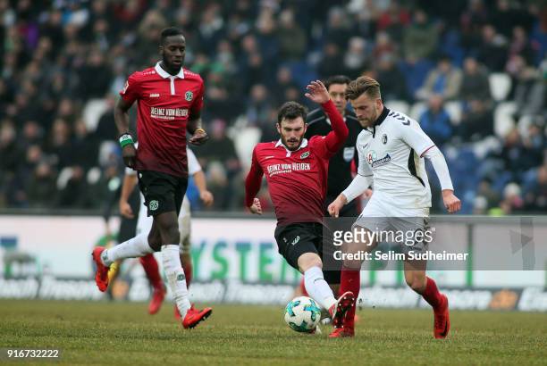 Josip Elez of Hannover 96 fights for the ball with Lucas Hoeler of SC Freiburg during the Bundesliga match between Hannover 96 and Sport-Club...