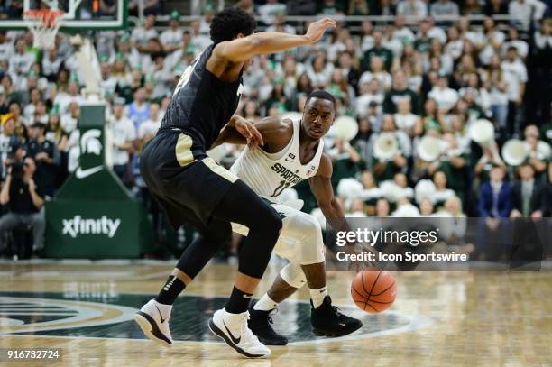 Michigan State Spartans guard Lourawls Tum Tum Nairn tries to circle around the defense of Purdue Boilermakers guard Nojel Eastern during a Big Ten...